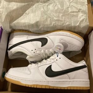 Nike SB 10 White Leather Low-Top Sneakers with Black Swoosh and Gum Sole